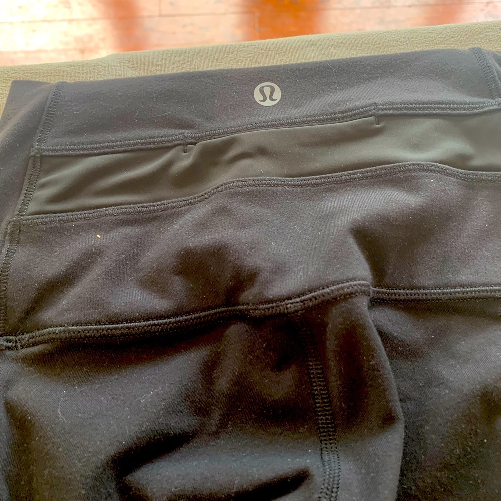 Lululemon  black tights with nylon on the back leg